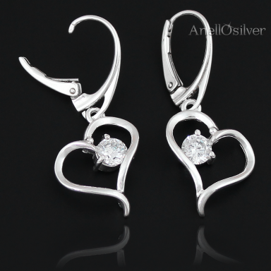 Silver earrings in the shape of a heart with zircon. 