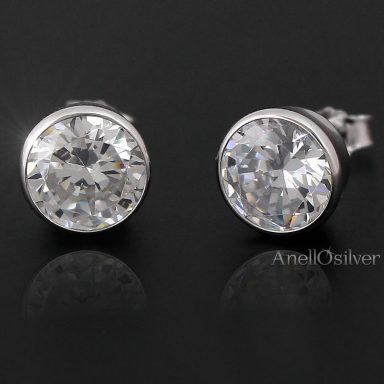 Silver, rhodium plated earrings with round zircon.